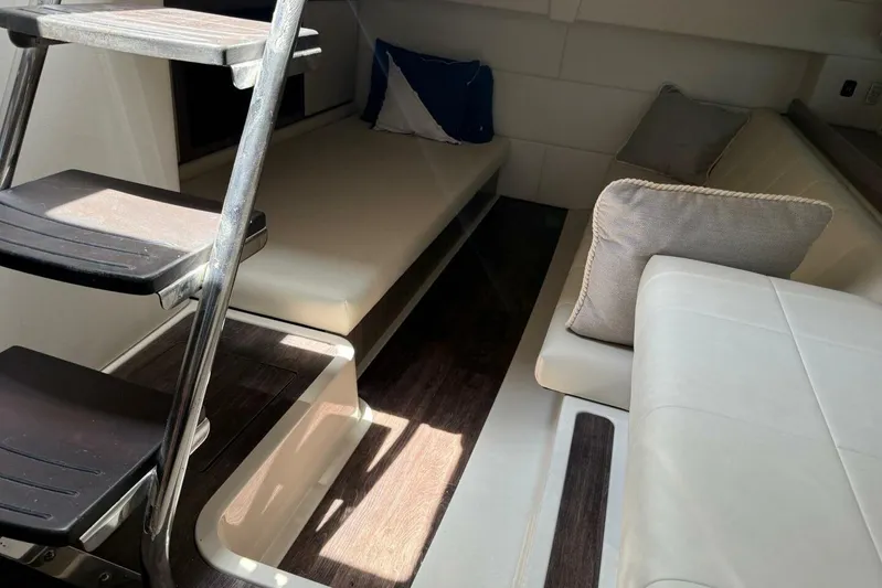  Yacht Photos Pics Interior of 2021 Regal 36 XO yacht with seating and stairs.