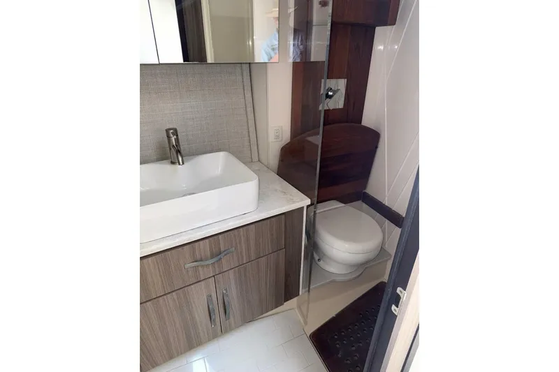  Yacht Photos Pics 2021 Regal 36 XO yacht bathroom with modern sink and toilet.