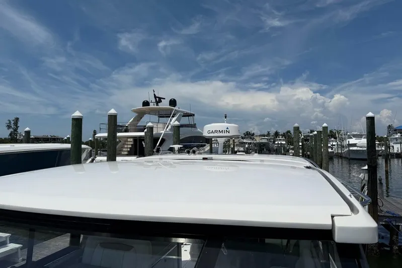 Yacht Photos Pics 2021 Regal 36 XO yacht docked at marina under clear blue sky.