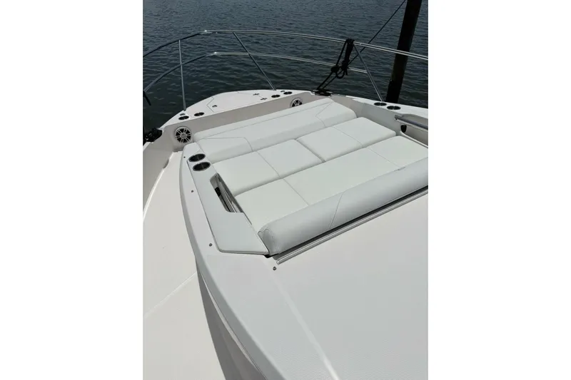  Yacht Photos Pics 2021 Regal 36 XO boat with white cushioned seating on deck.