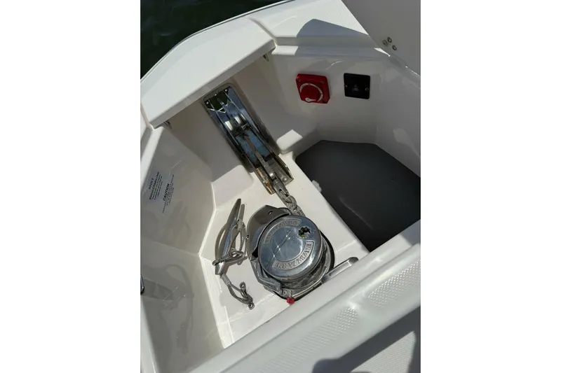  Yacht Photos Pics 2021 Regal 36 XO boat anchor compartment with winch and control panel.