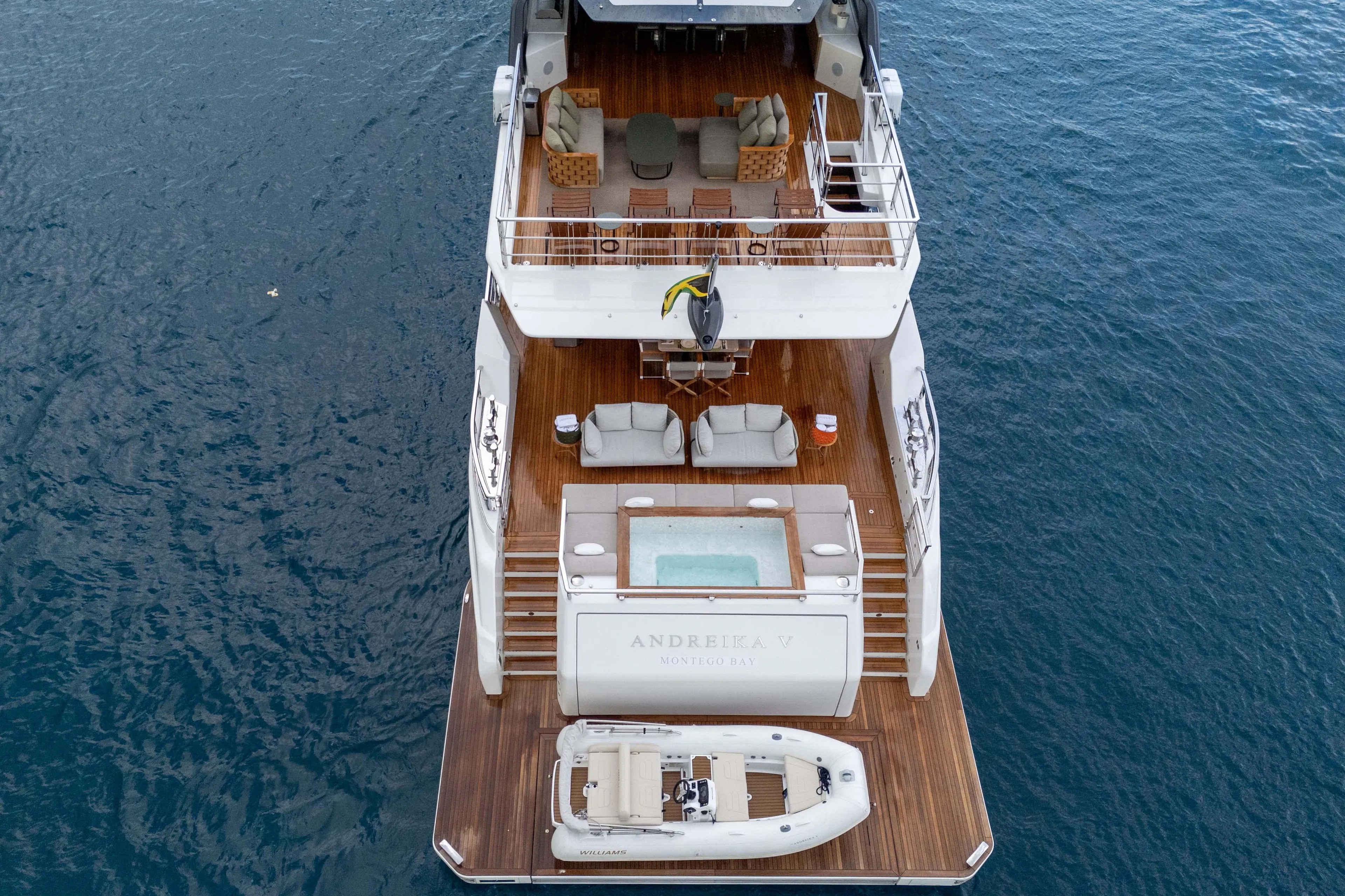 Luxurious 2025 Alpha Squalo Co Ownership yacht with deck, jacuzzi, and tender boat.