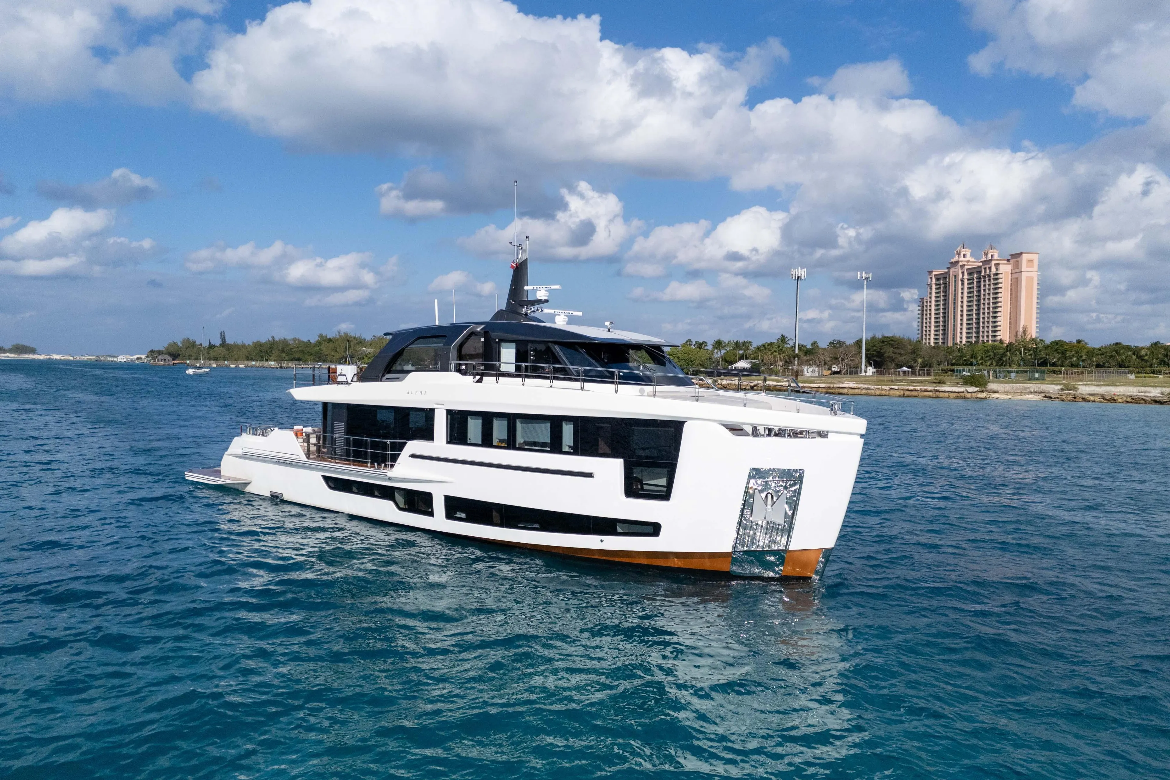 Luxurious 2025 Alpha Squalo Co Ownership yacht cruising on clear blue waters.