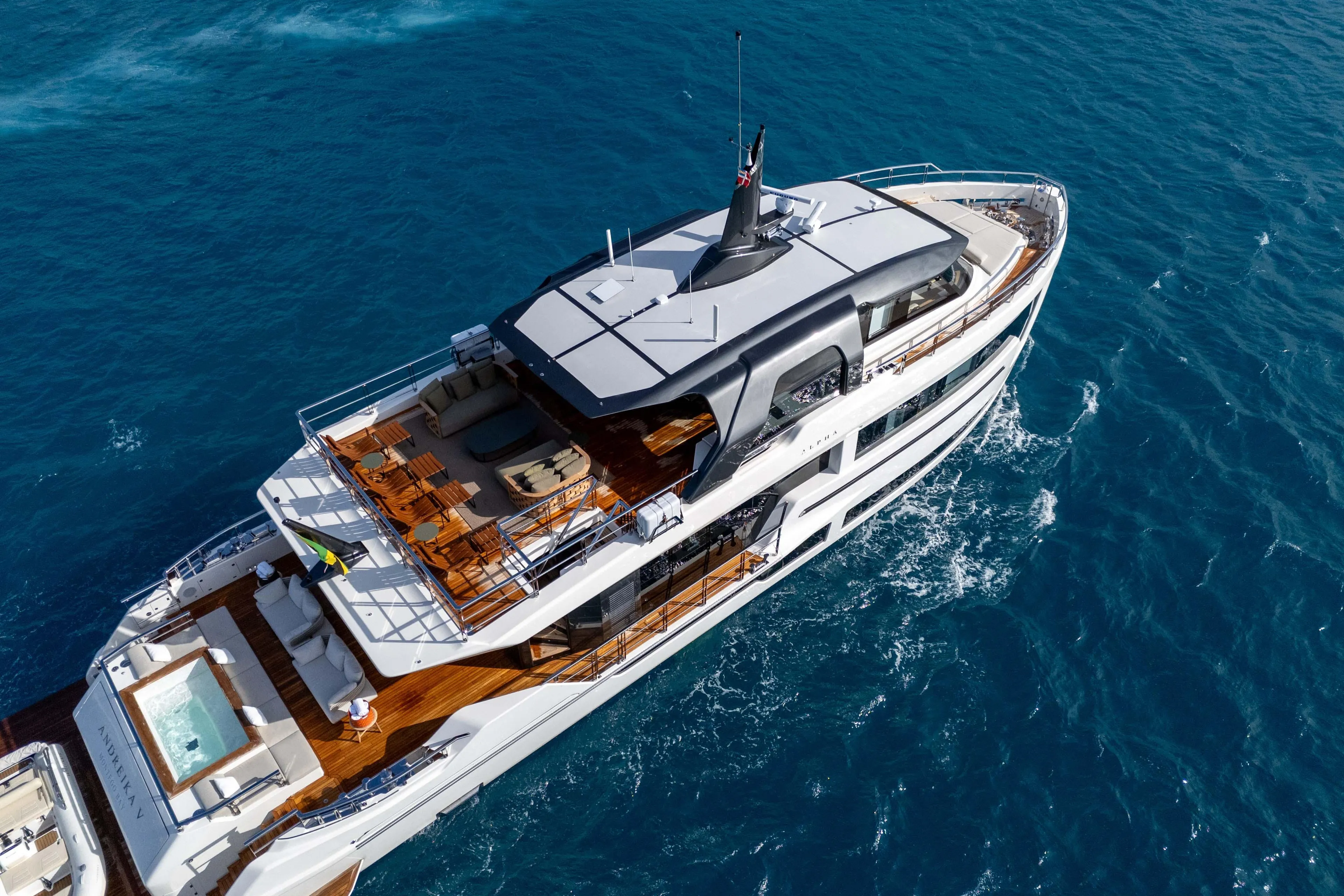Luxurious 2025 Alpha Squalo Co Ownership yacht cruising on blue ocean waters.