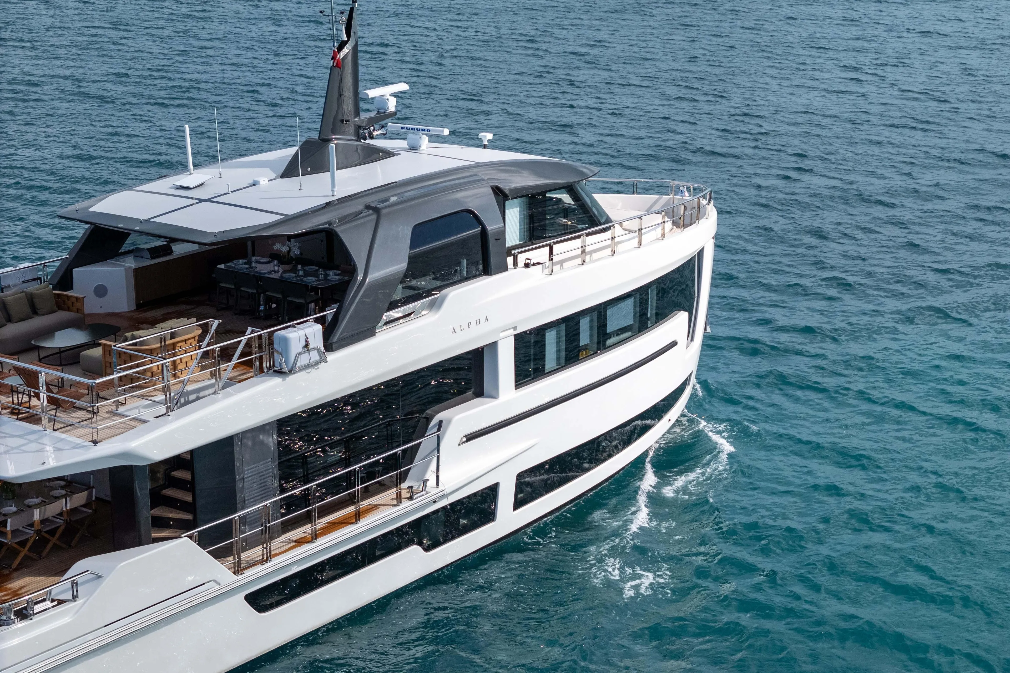 Luxurious 2025 Alpha Squalo Co Ownership yacht cruising on clear blue waters.