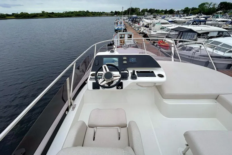  Yacht Photos Pics Cockpit view of 2025 Prestige F4.9 yacht docked at marina.