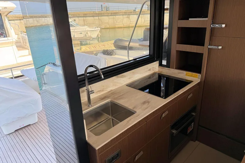 Yacht Photos Pics Modern kitchen area on a 2025 Prestige F4.9 yacht, featuring sleek design and appliances.