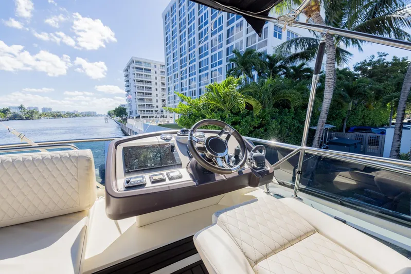 Giada Maria Yacht Photos Pics Helm of 2016 Beneteau Monte Carlo 5 yacht with cityscape and waterway view.