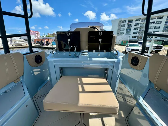  Yacht Photos Pics 2025 Ranieri CAYMAN 28 EXECUTIVE boat interior with beige seating and modern controls.