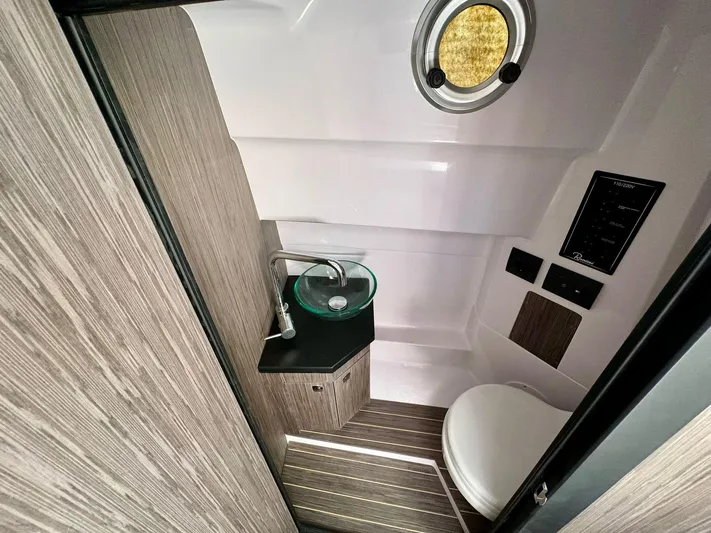  Yacht Photos Pics 2025 Ranieri CAYMAN 28 EXECUTIVE boat bathroom with modern sink and toilet.