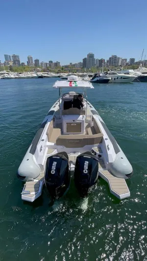 Yacht Photos Pics 2025 Ranieri CAYMAN 28 EXECUTIVE boat with twin outboard engines in a marina.