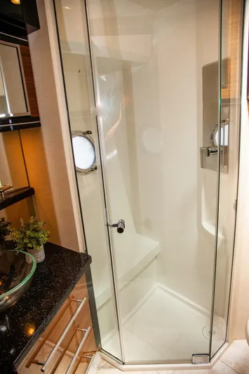  Yacht Photos Pics 2009 Marquis 500 Sport Coupe yacht bathroom with glass shower enclosure.