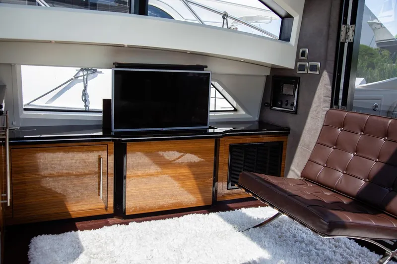  Yacht Photos Pics Luxurious interior of 2009 Marquis 500 Sport Coupe yacht with modern furnishings and sleek design.