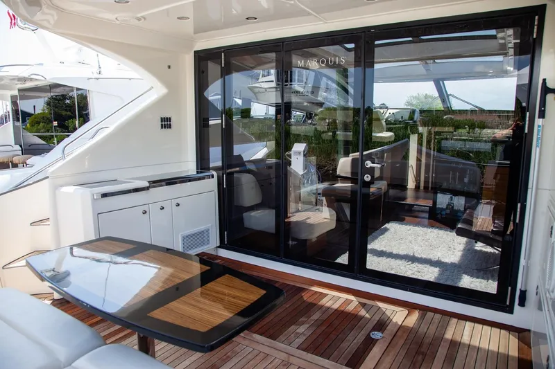  Yacht Photos Pics 2009 Marquis 500 Sport Coupe yacht with elegant deck and glass doors.