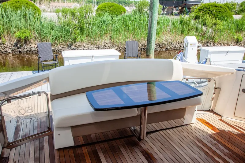  Yacht Photos Pics Luxury seating area on 2009 Marquis 500 Sport Coupe yacht deck.