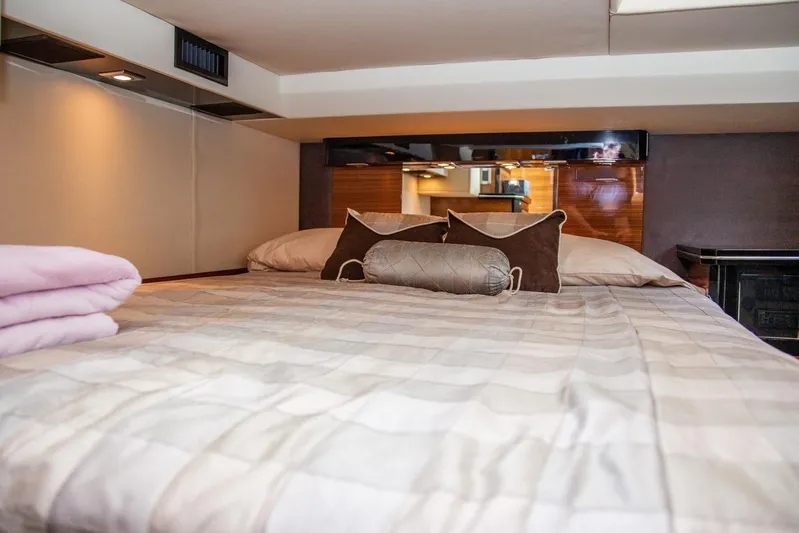  Yacht Photos Pics Luxurious bedroom interior of 2009 Marquis 500 Sport Coupe yacht.