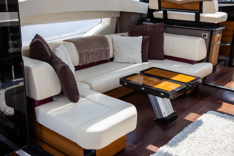  Yacht Photos Pics Luxurious interior of 2009 Marquis 500 Sport Coupe with plush seating and elegant decor.