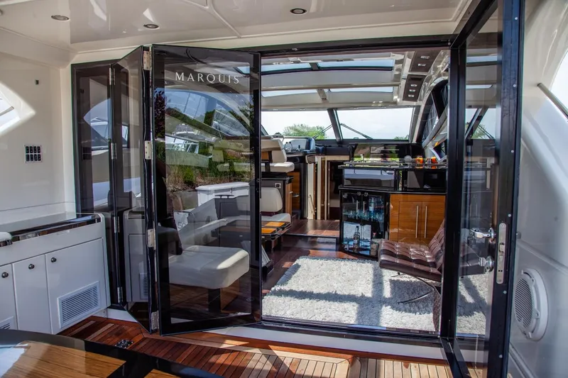  Yacht Photos Pics Luxurious interior of 2009 Marquis 500 Sport Coupe yacht with modern design and elegant furnishings.