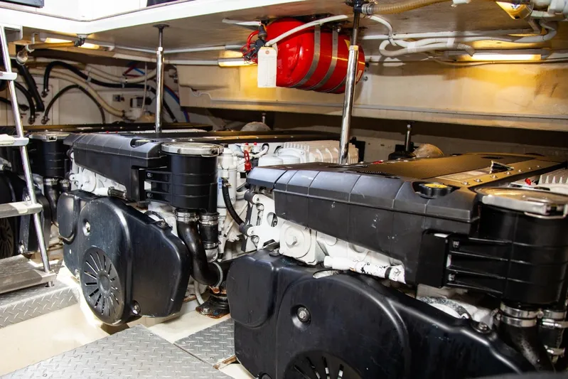  Yacht Photos Pics Engine room of 2009 Marquis 500 Sport Coupe with dual engines and fire extinguisher.