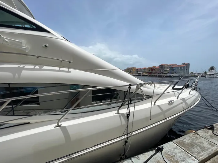 Summer Girl Yacht Photos Pics 2007 Cruisers Yachts 497 Sport Sedan docked at marina under clear sky.