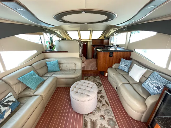 Summer Girl Yacht Photos Pics Luxurious interior of 2007 Cruisers Yachts 497 Sport Sedan with plush seating and modern design.