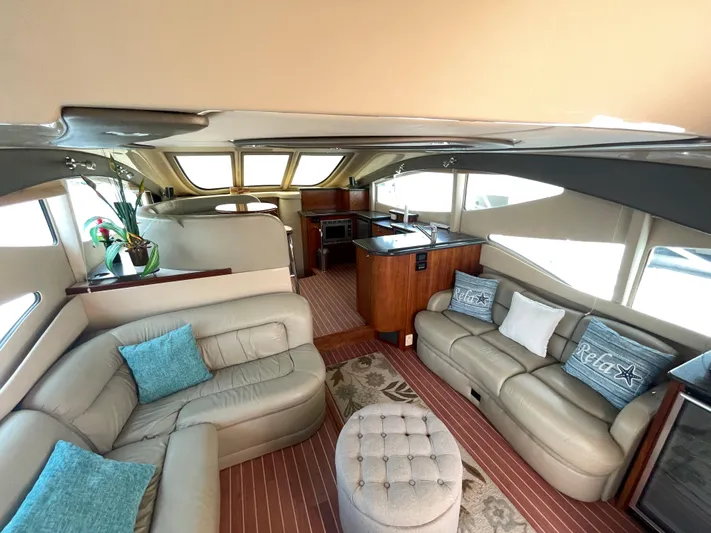 Summer Girl Yacht Photos Pics Luxurious interior of 2007 Cruisers Yachts 497 Sport Sedan with plush seating and modern decor.