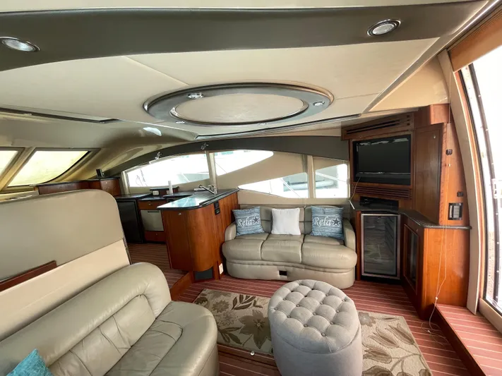 Summer Girl Yacht Photos Pics Luxurious interior of 2007 Cruisers Yachts 497 Sport Sedan with leather seating and modern amenities.