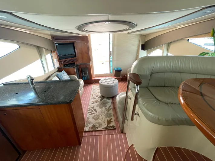 Summer Girl Yacht Photos Pics Luxurious interior of 2007 Cruisers Yachts 497 Sport Sedan with modern furnishings.