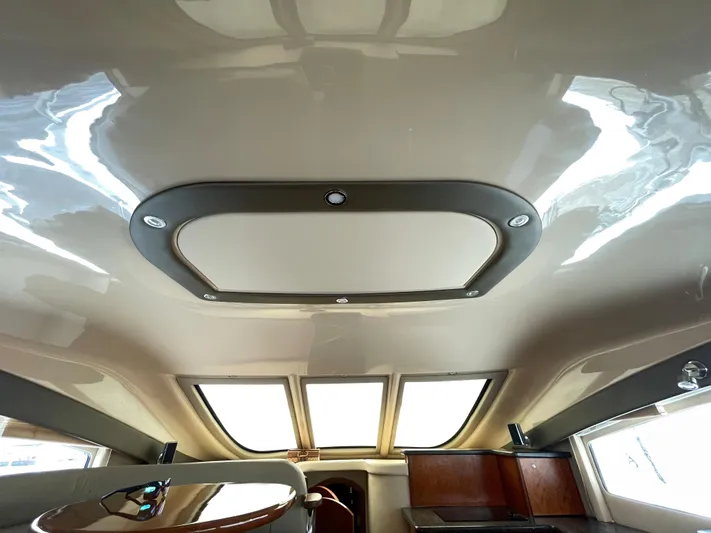 Summer Girl Yacht Photos Pics Interior view of 2007 Cruisers Yachts 497 Sport Sedan with sleek ceiling design.