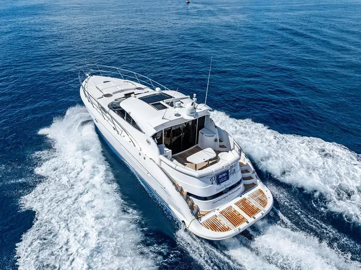  Yacht Photos Pics 2003 Neptunus 56 Express yacht cruising on open blue waters.