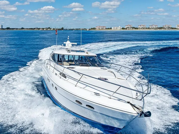  Yacht Photos Pics 2003 Neptunus 56 Express yacht cruising on open water under a clear sky.