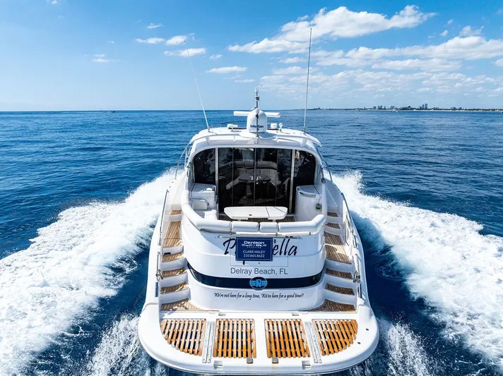  Yacht Photos Pics 2003 Neptunus 56 Express yacht cruising on open sea under clear blue sky.