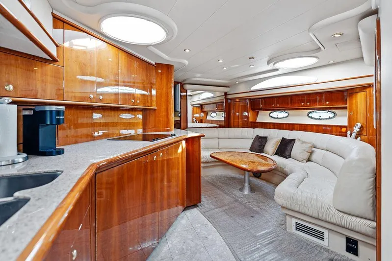  Yacht Photos Pics Luxurious interior of 2003 Neptunus 56 Express yacht with elegant wood finishes.