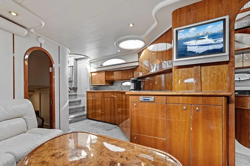  Yacht Photos Pics Luxurious interior of a 2003 Neptunus 56 Express yacht with elegant wood finishes.