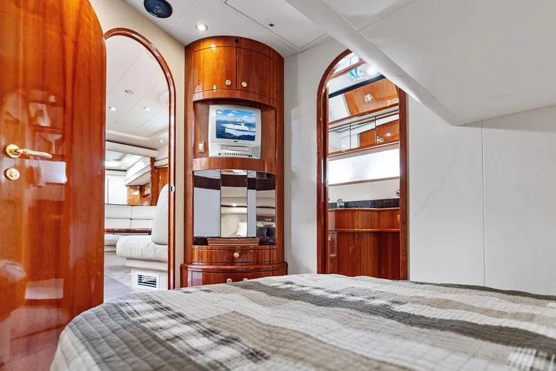  Yacht Photos Pics Luxurious interior of 2003 Neptunus 56 Express yacht with wood finishes and modern amenities.