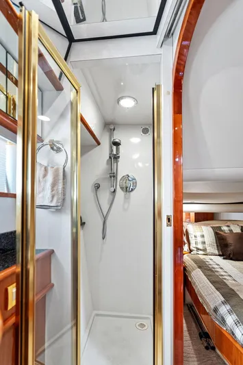  Yacht Photos Pics 2003 Neptunus 56 Express yacht interior with shower and bedroom.