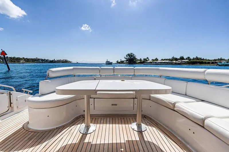  Yacht Photos Pics Luxurious 2003 Neptunus 56 Express yacht deck with seating and ocean view.