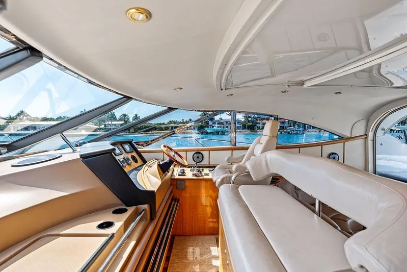  Yacht Photos Pics Luxurious interior of 2003 Neptunus 56 Express yacht with panoramic windows and plush seating.