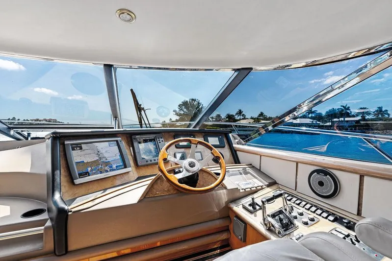  Yacht Photos Pics 2003 Neptunus 56 Express yacht helm with modern navigation equipment and panoramic views.