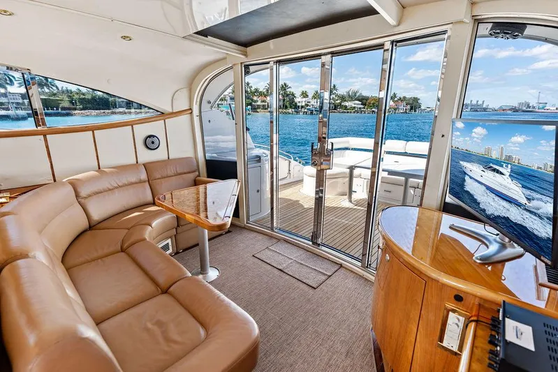  Yacht Photos Pics Luxurious interior of 2003 Neptunus 56 Express yacht with leather seating and ocean view.