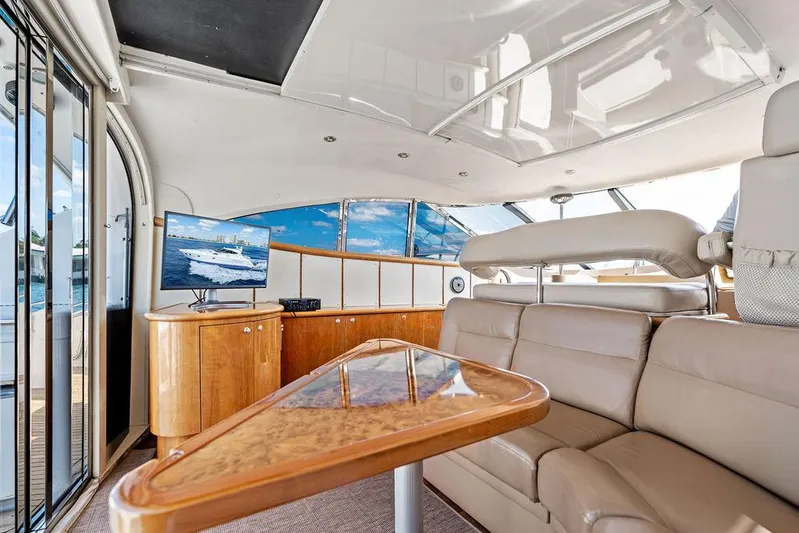  Yacht Photos Pics Luxurious interior of 2003 Neptunus 56 Express yacht with leather seating and modern amenities.