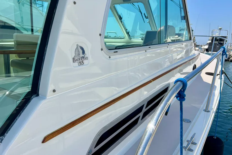 Cabrillo Yacht Photos Pics 2008 Back Cove 33 Express yacht docked, showcasing sleek design and polished exterior.