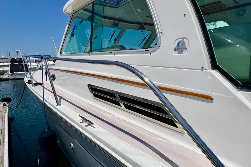 Cabrillo Yacht Photos Pics 2008 Back Cove 33 Express yacht docked, showcasing sleek design and polished railings.