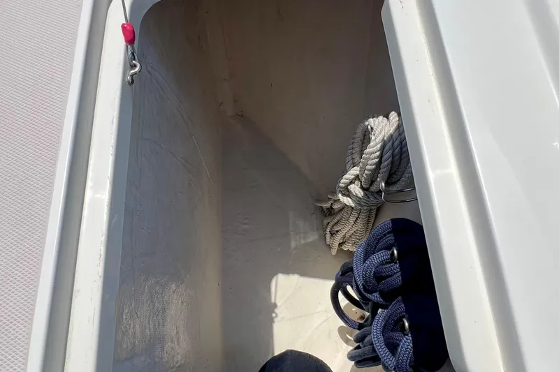 Cabrillo Yacht Photos Pics Storage compartment on a 2008 Back Cove 33 Express boat with ropes and fenders.