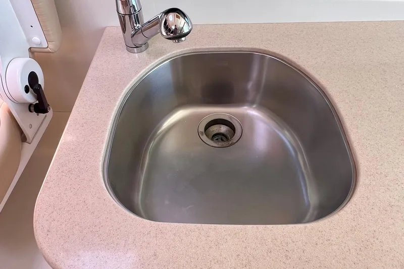 Cabrillo Yacht Photos Pics Stainless steel sink in 2008 Back Cove 33 Express boat kitchen area.