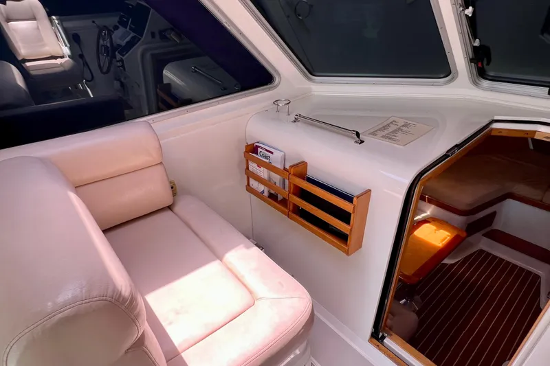 Cabrillo Yacht Photos Pics 2008 Back Cove 33 Express interior with cream seating and wooden accents.