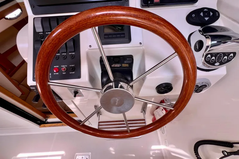 Cabrillo Yacht Photos Pics 2008 Back Cove 33 Express helm with wooden steering wheel and control panel.