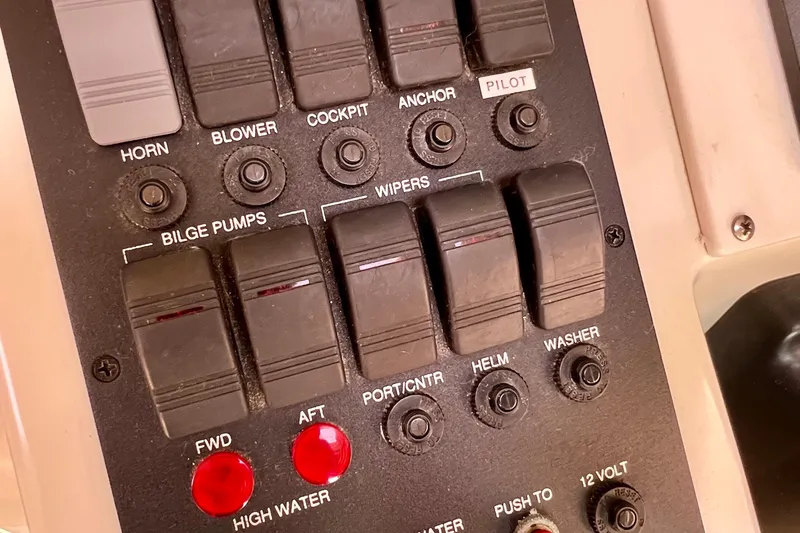 Cabrillo Yacht Photos Pics Control panel of a 2008 Back Cove 33 Express boat with various switches and indicators.