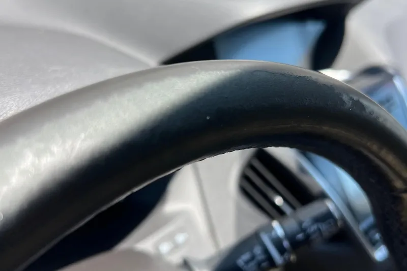 Cabrillo Yacht Photos Pics Close-up of a steering wheel in a 2008 Back Cove 33 Express boat.