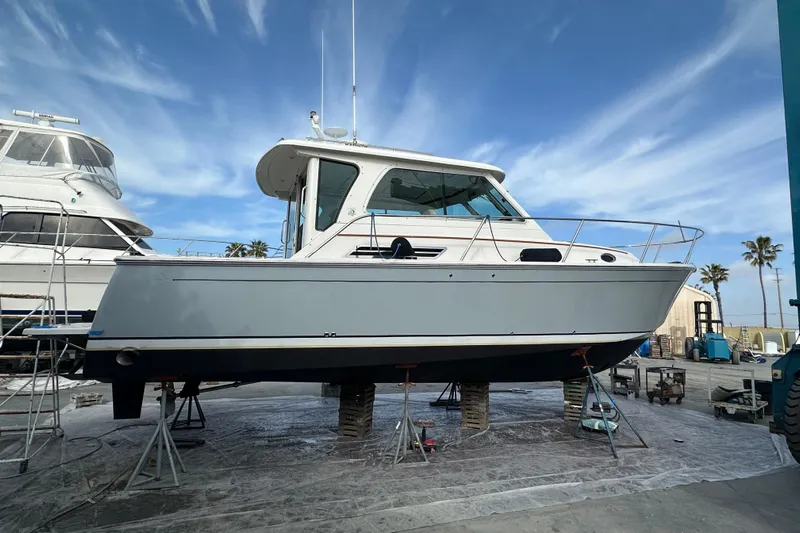 Cabrillo Yacht Photos Pics 2008 Back Cove 33 Express boat on stands, marina setting, clear sky background.